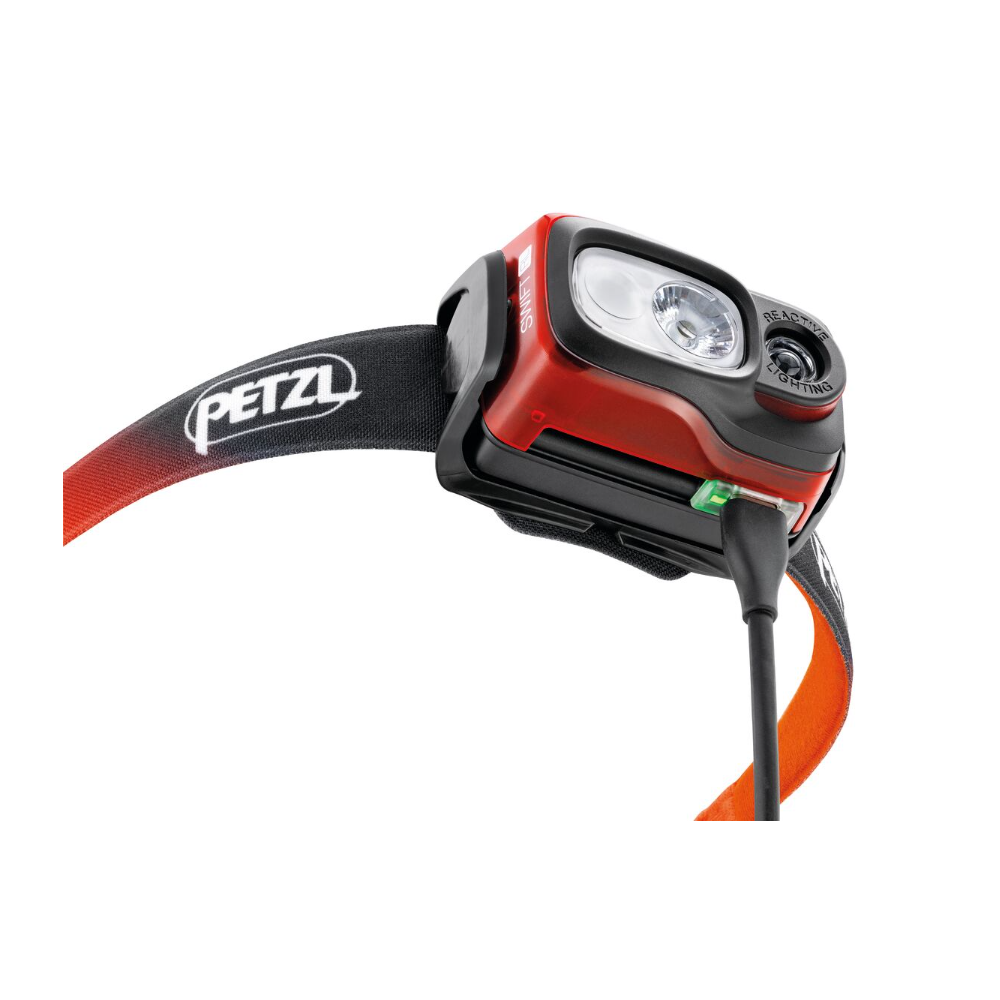 Hodelykt Swift® RL 1100 Lumen fra Petzl batterilader
